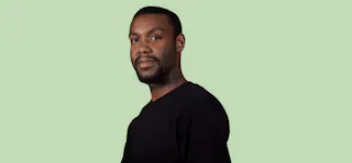 man and green background