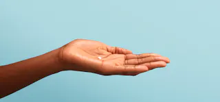 hand with birth control pill