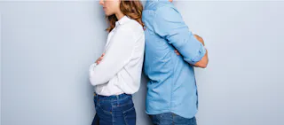 couple with backs turned to each other