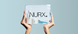 Hands holding a clear bag containing three Nurx skincare products against a light blue background.