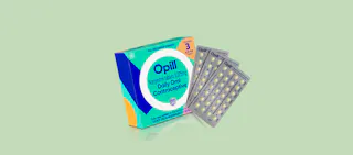 A box of Opill birth control is shown against a light green background, featuring three blister packs of daily oral contraceptive pills.