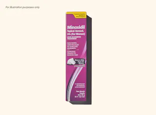 A box of Minoxidil topical aerosol 5% for women, used for hair regrowth treatment, positioned upright against a neutral background.