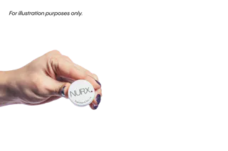 Hand holding a small round container labeled 