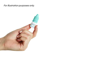 A hand holds a small bottle with a teal cap, likely containing eye drops or medication, against a white background.