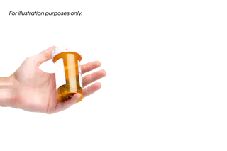 A hand holds an amber prescription pill bottle with a white cap against a black background.