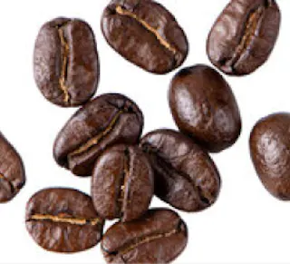 Close-up image of roasted coffee beans on a white background.