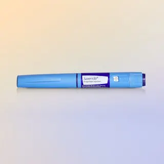 Saxenda injection pen against a gradient background