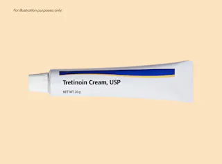 Tretinoin cream, USP tube against yellow background