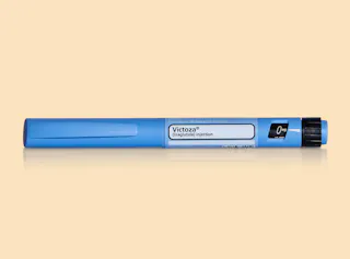 Victoza GLP1 injectable pen against a gradient background