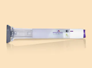 Mounjaro GLP1 injectable pen against a gradient background
