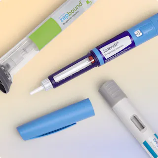 Three injectable medication pens, labeled as ZepBound, Saxenda, and Wegovy, are arranged diagonally on a pastel gradient background with their caps removed or nearby.